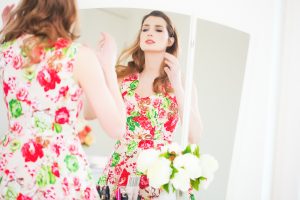 Woman Looking At Mirror